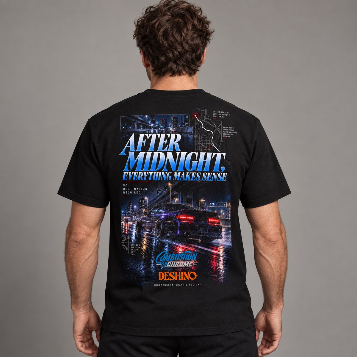 A man viewed from behind wearing a black t-shirt with a large graphic print on the back. The graphic features the text 'AFTER MIDNIGHT EVERYTHING MAKES SENSE' in blue and white, a city street scene at night with a sports car, and the brands 'Combustion & Chrome' and 'Deshino'.