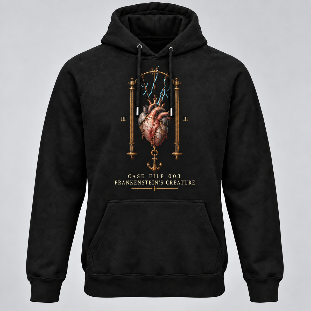 A black pullover hoodie with a detailed graphic on the chest showing an anatomical heart suspended between two pillars with blue lightning, Roman numerals, and the text 'CASE FILE 003 FRANKENSTEIN'S CREATURE' below, displayed against a neutral grey background.