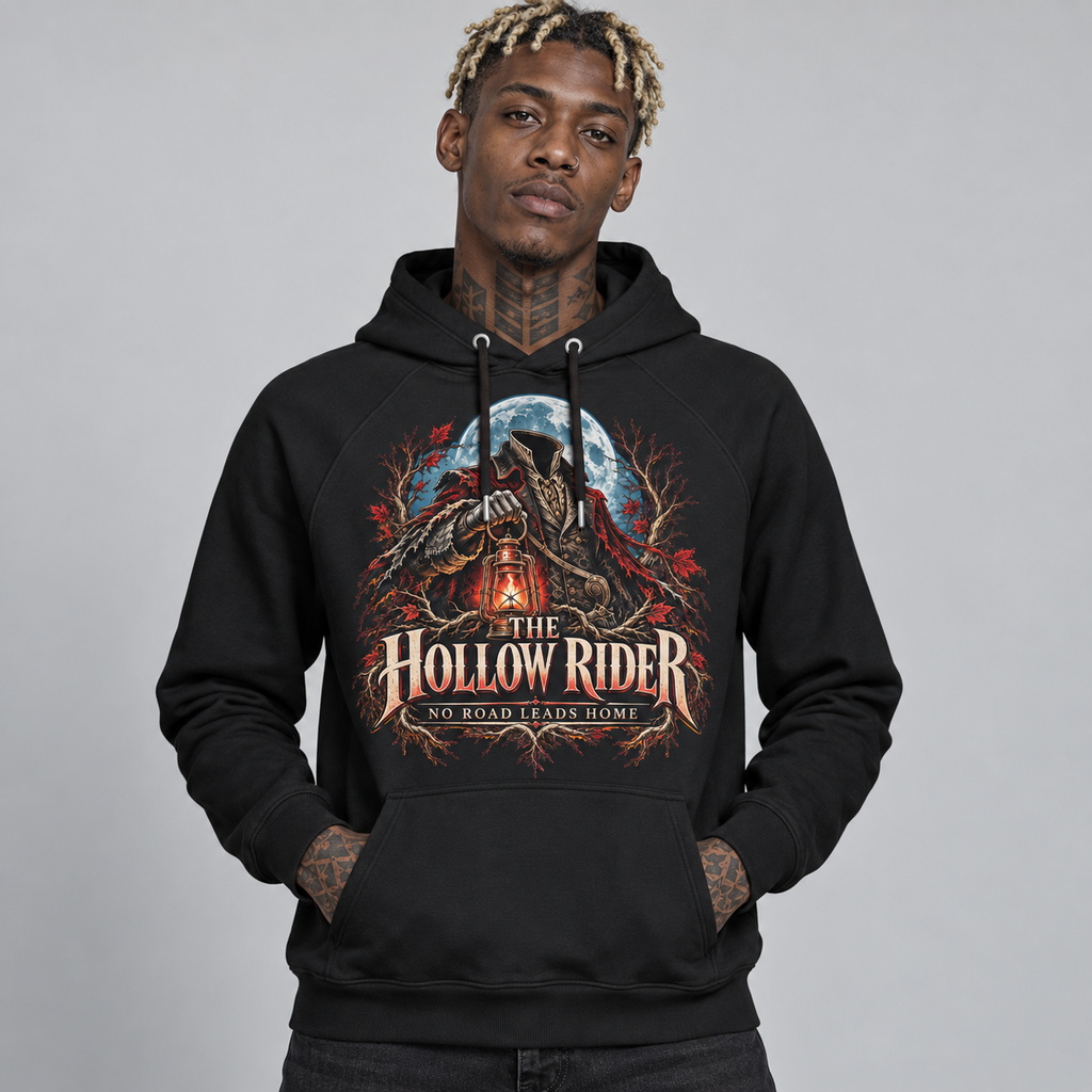 A man wearing a black pullover hoodie with a large graphic print on the front. The graphic features a wolf, a full moon, and the text 'THE HOLLOW RIDER' and 'NO ROAD LEADS TO HOME'.