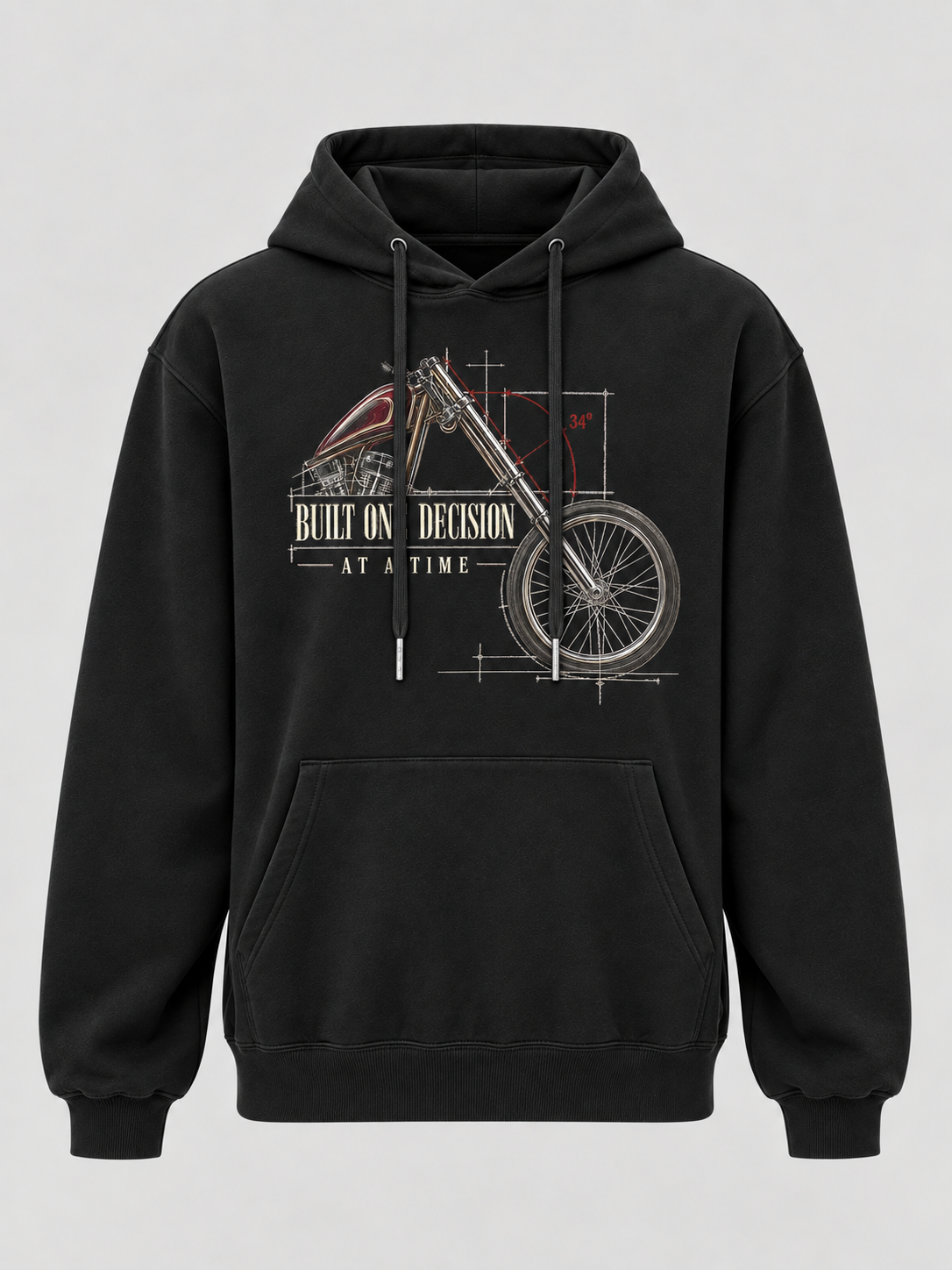 A black pullover hoodie with a front graphic of a vintage motorcycle rendered like a technical blueprint, featuring the text 'BUILT ONE DECISION AT A TIME'.