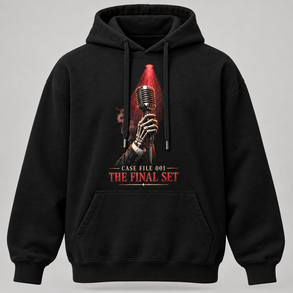 A black pullover hoodie with a graphic print on the front showing a skeletal hand holding a vintage microphone under a red spotlight, with the text 'CASE FILE 001 THE FINAL SET' below it, displayed against a neutral gray background.