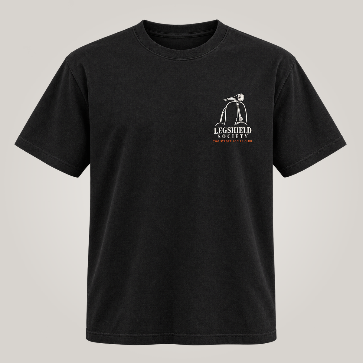 A black short-sleeve crewneck t-shirt with a small white and orange graphic on the left chest, displayed against a neutral light grey background.