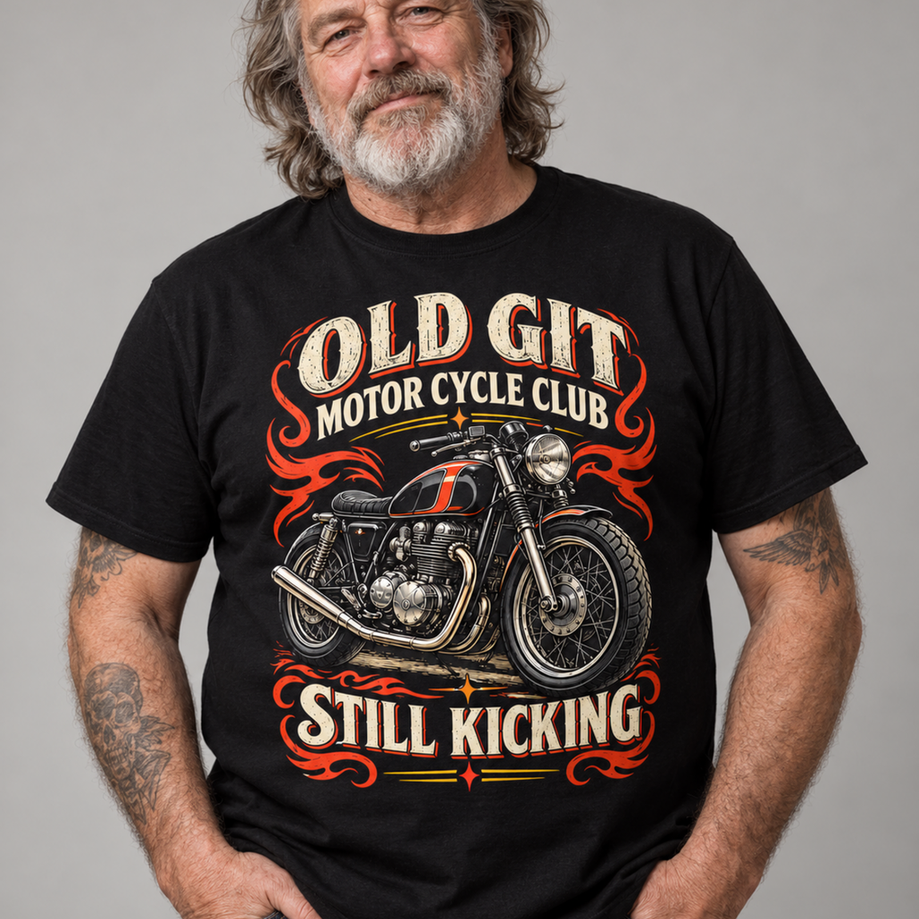 A man wearing a black graphic t-shirt with a vintage-style motorcycle print and the text 'OLD GIT MOTOR CYCLE CLUB' and 'STILL KICKING'.