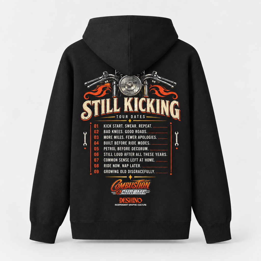 A black pullover hoodie shown from the back, featuring a large graphic print with a motorcycle headlight illustration, the words 'Still Kicking Tour Dates,' a numbered list of slogans, and a 'Combustion & Chrome' logo near the bottom.