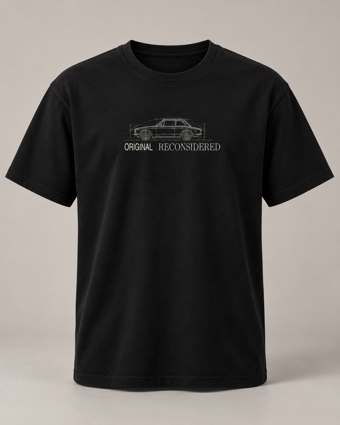 A black short-sleeve crewneck t-shirt with a white line-art graphic of a car and the text 'ORIGINAL RECONSIDERED' printed on the chest, displayed against a neutral gray background.